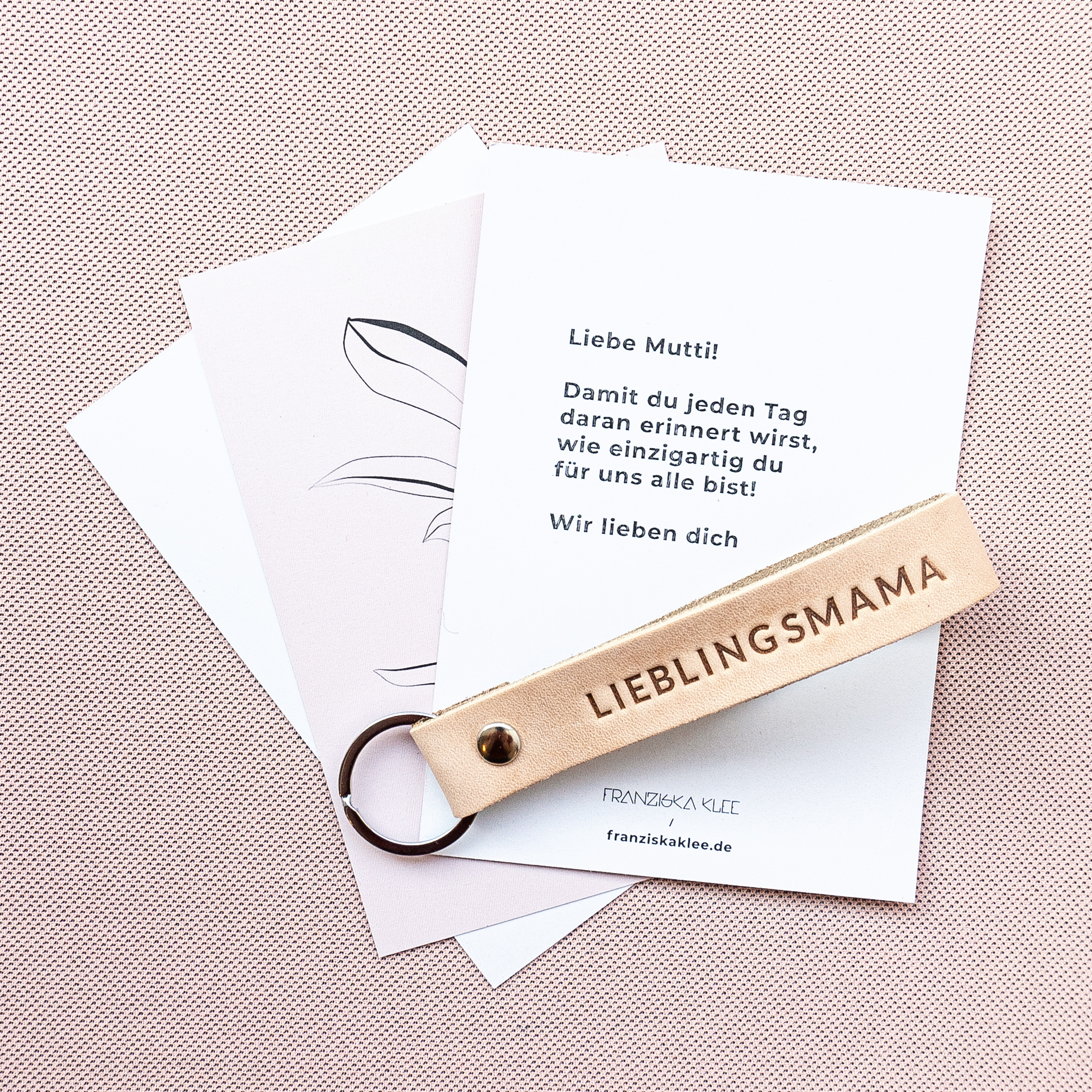 Schlüsselband LOC in der Farbe Hellbraun mit der Prägung 