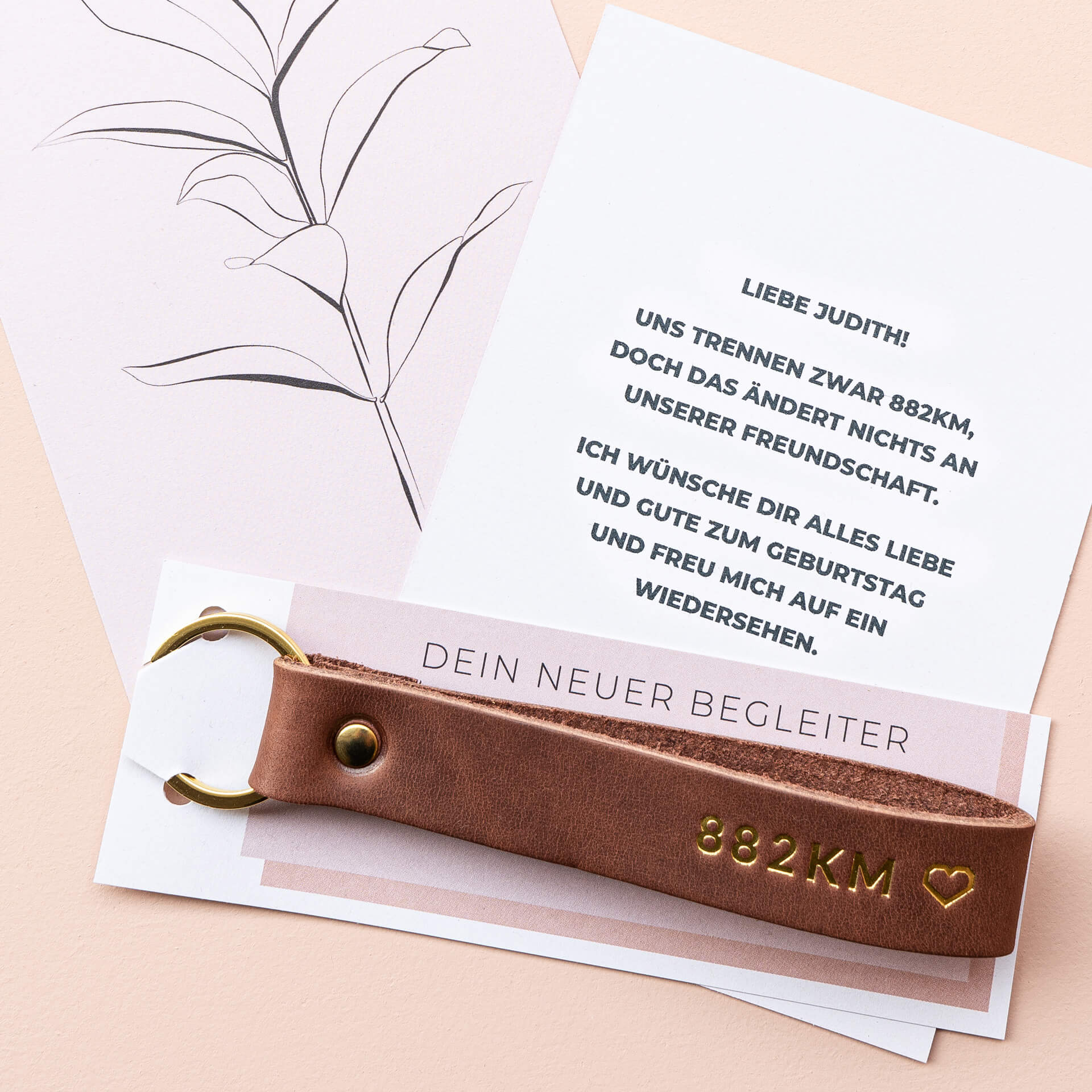 Schlüsselband LOC in der Farbe Dunkelbraun Prägung in Gold.